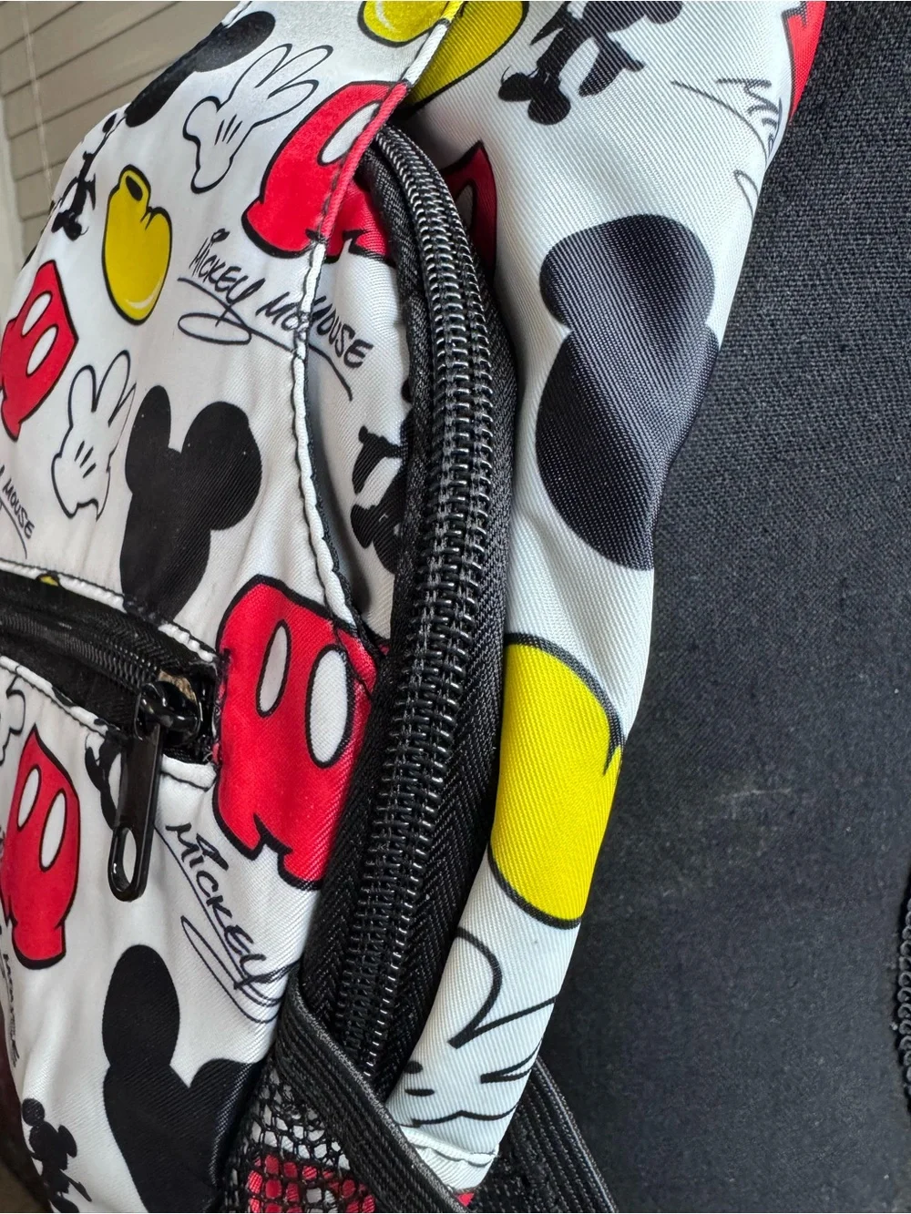 Disney White Sling Backpack with Red & Yellow Mickey Icons